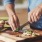 man cutting food The Beam New London CT luxury apartments