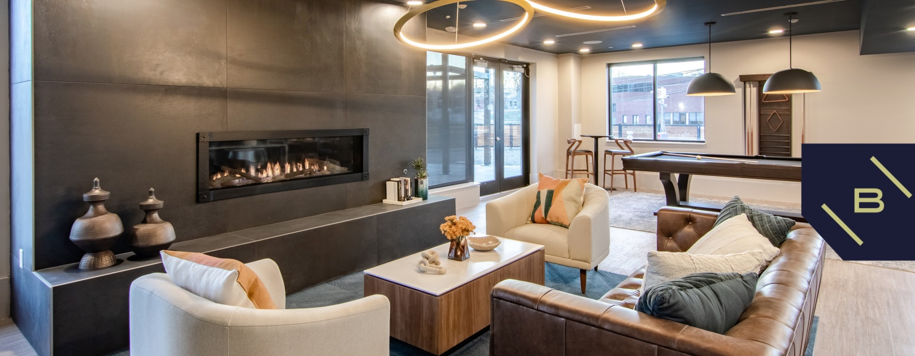 lounge with seating, fireplace and billiards - the beam new london ct luxury apartments